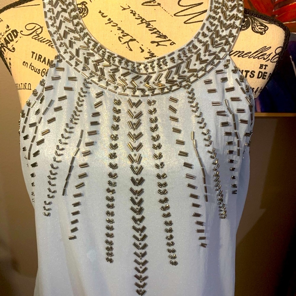 Cache top. Light blue shimmering fabric w/silver